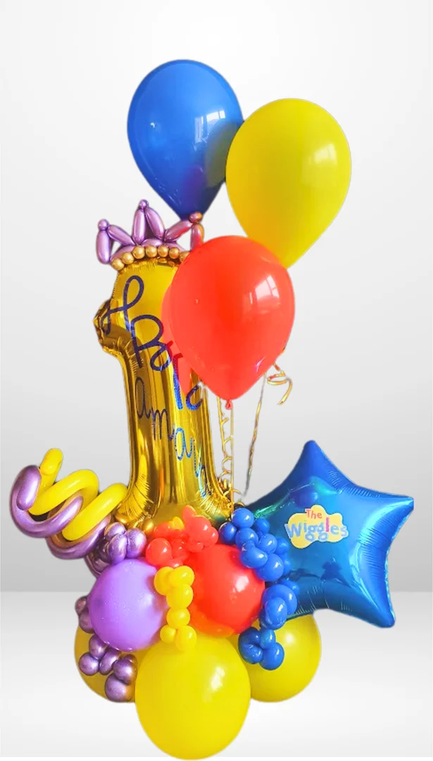 Gold 1 foil number with a blue Wiggles star balloon, a twisted balloon crown and red, blue and yellow helium balloons